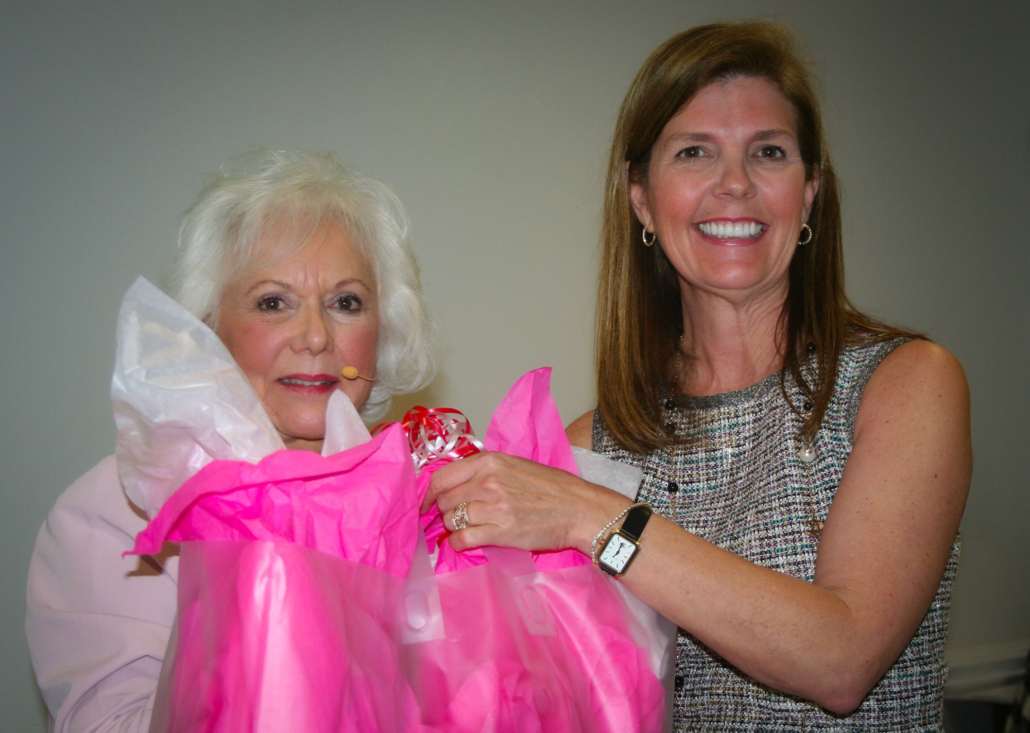 Chamber Executive Director Charlotte Tallent presents SC Lieutenant Governor Pamela Evette, keynote speaker at the Women in Business event, with a basket of gifts from local businesses.